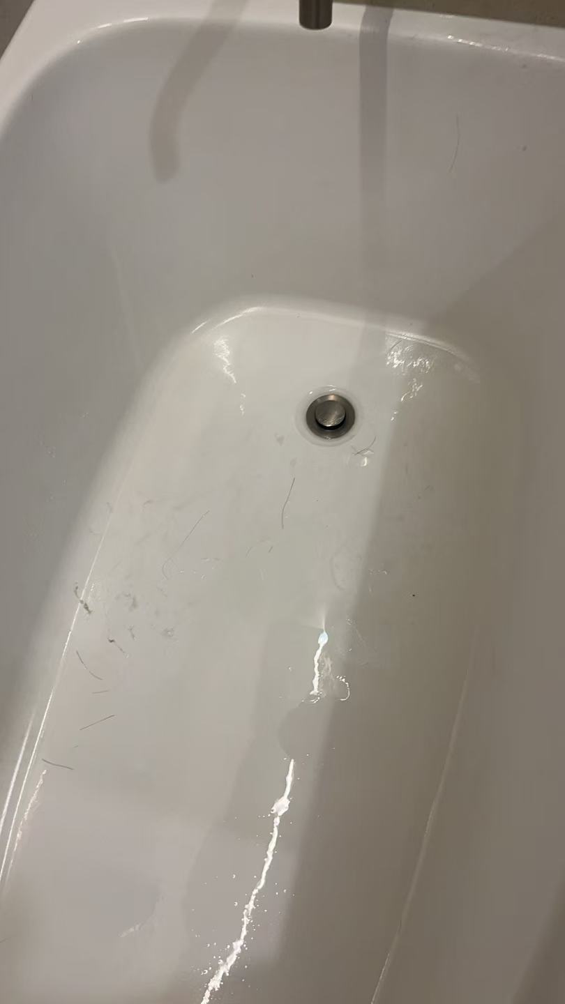 Bath outlet before drain clearing in an Ellis Services Brisbane project