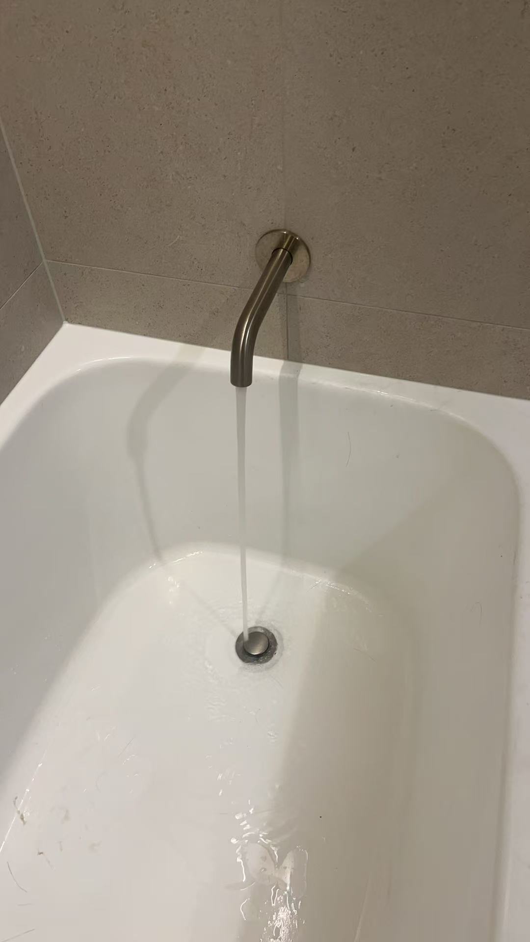 Water moving towards the bath waste during an Ellis Services flow check